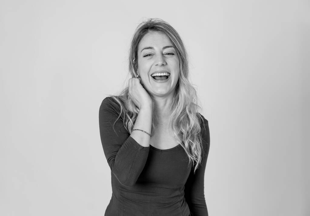 Close up portrait of a young beautiful caucasian woman with happy face and beautiful smile. Isolated on neutral background. In People, positive human facial expressions and emotions concept. - Photo, Image