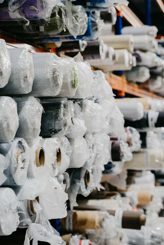 A vertical shot of wallpaper rolls at a store - Photo, Image