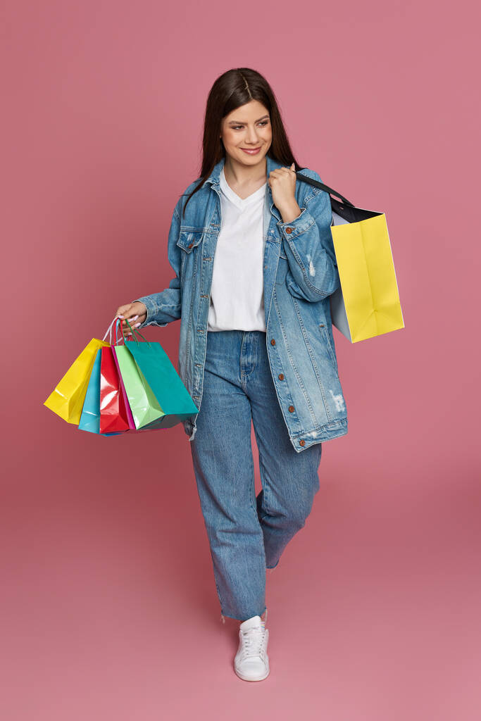 beautiful woman holding shopping bags with purchases - Photo, Image