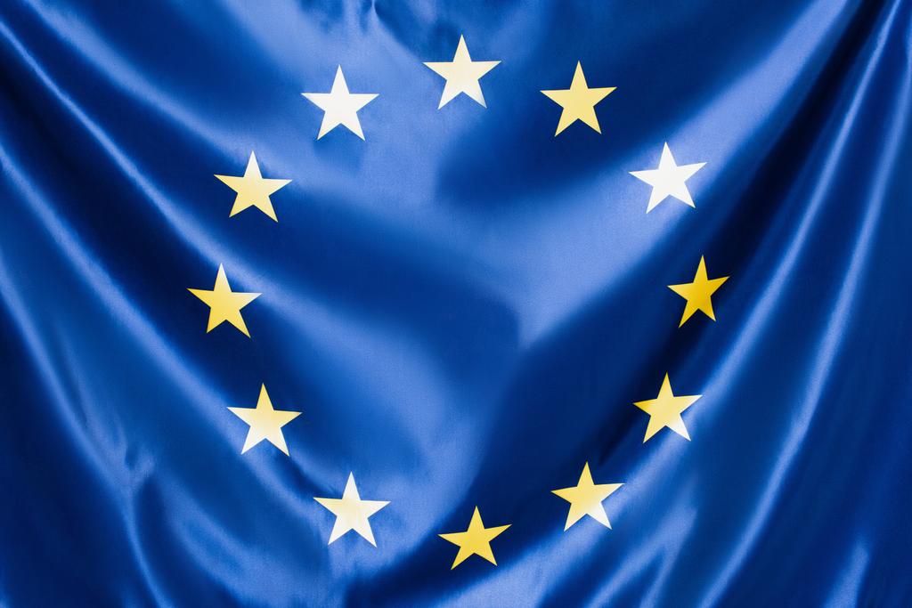 close up of blue european union flag with yellow stars - Fotoğraf, Görsel
