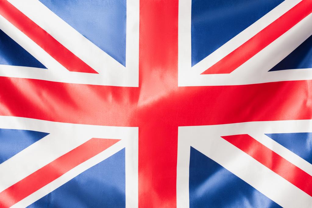 zbliżenie brytyjskiej flagi zjednoczonego królestwa z czerwonym krzyżem - Zdjęcie, obraz