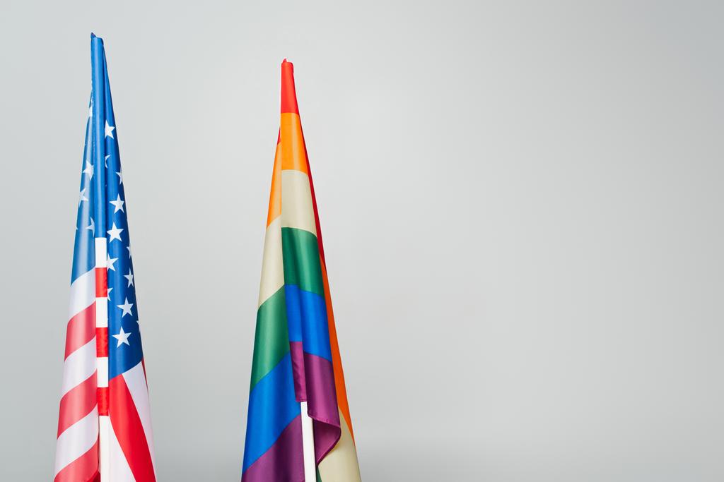 american and colorful lgbt flags isolated on grey, equality rights concept - Photo, Image