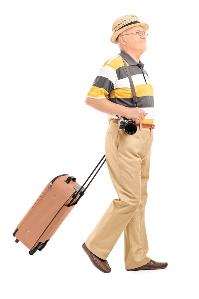 Turista maduro llevando su equipaje
 - Foto, imagen