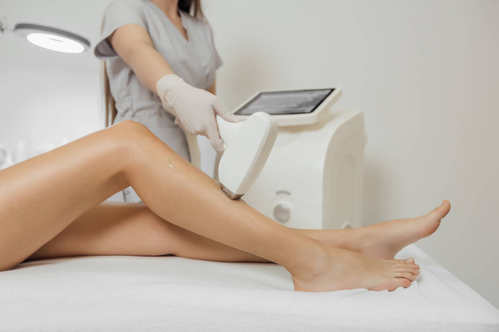 Woman has a laser epilation and cosmetology procedure - Photo, Image