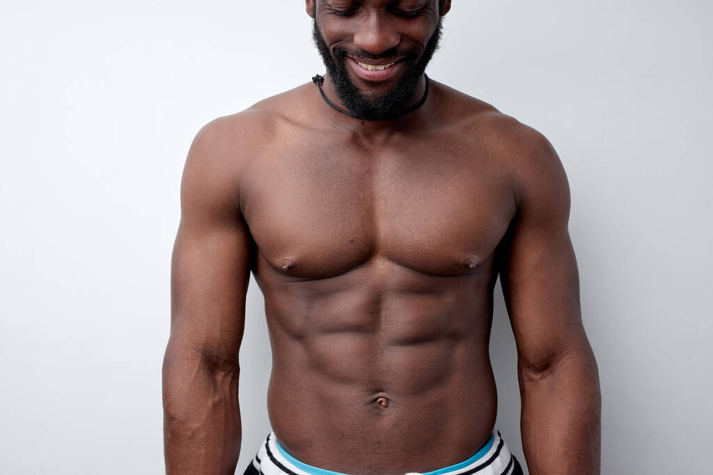 Cropped photo of strong muscular black man with naked torso, bodybuilder concept - Photo, Image