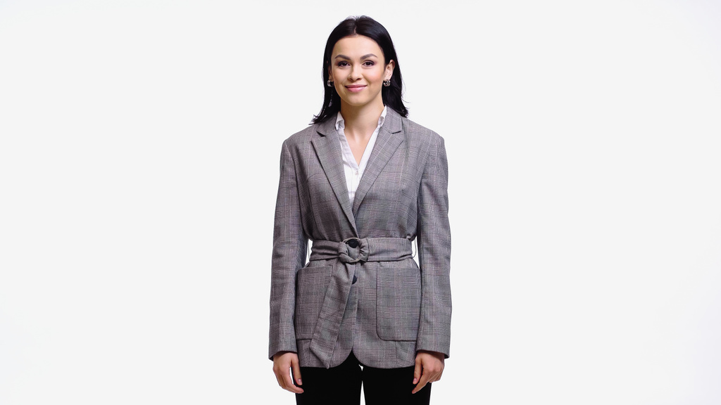 Mujer de negocios sonriente con chaqueta mirando a la cámara aislada en blanco - Foto, Imagen