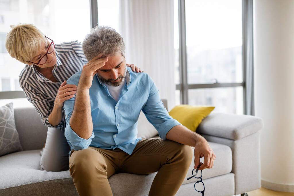 Senior woman comforting elderly man with depression, health problem, stress at home - Photo, Image