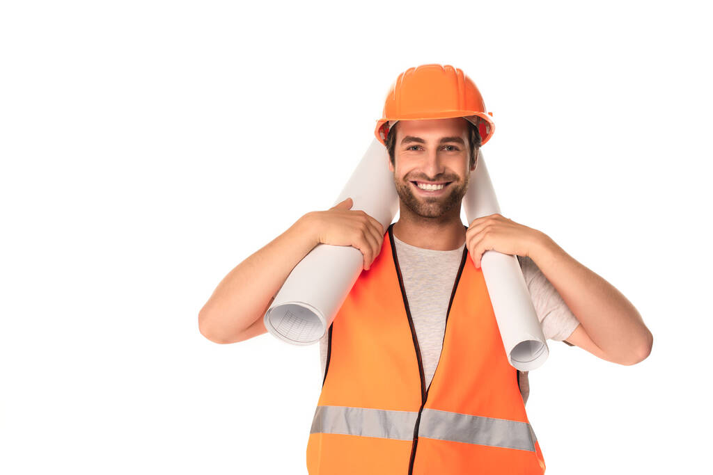 Happy builder in safety vest holding blueprints isolated on white  - Photo, Image