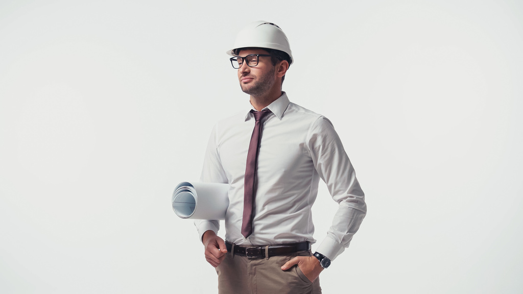 Inženýr s půdorysem stojící izolovaně na bílém - Fotografie, Obrázek
