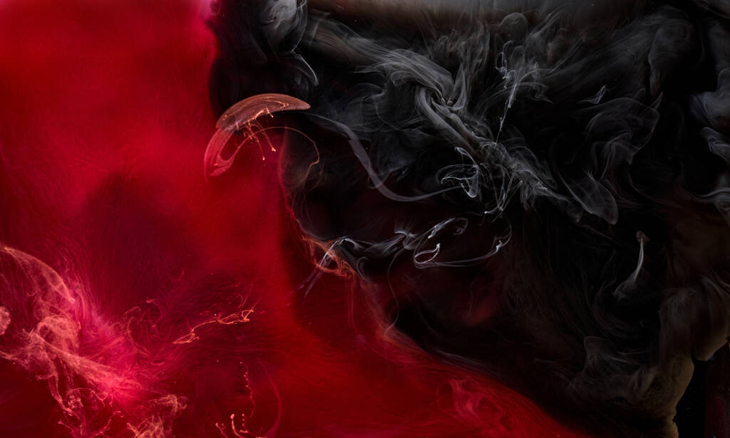 Red black pigment swirling ink abstract background, liquid smoke paint underwater - Photo, Image
