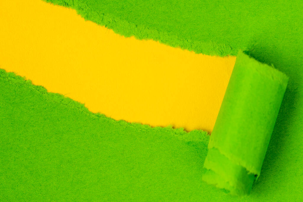 Зелений папір розривається, щоб відкрити жовтий простір копіювання ідеально підходить для вашого тексту
 - Фото, зображення