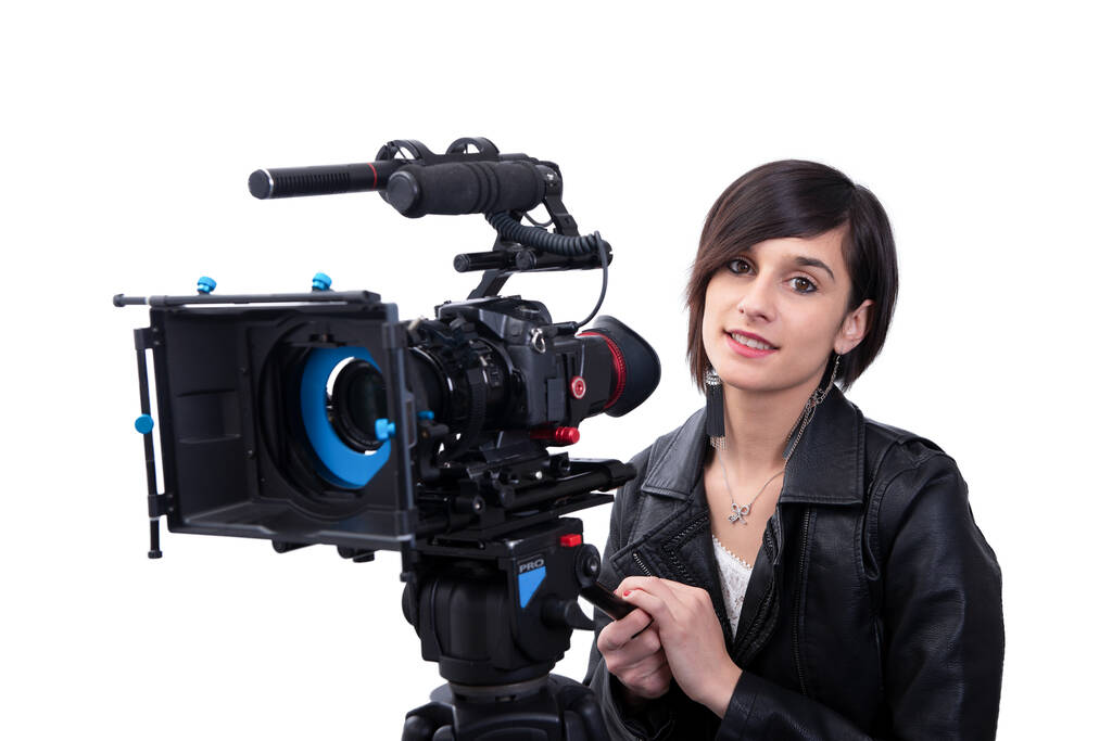 una joven con cámara de vídeo profesional, SLR, en blanco
 - Foto, Imagen