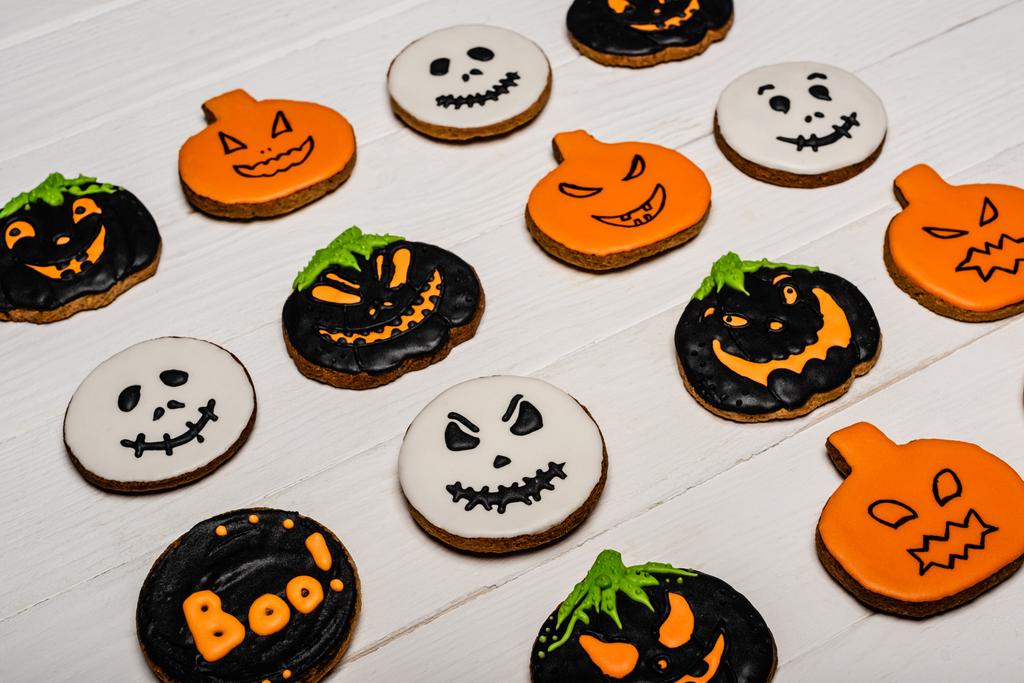 high angle view of homemade and tasty halloween cookies on white surface  - Photo, Image