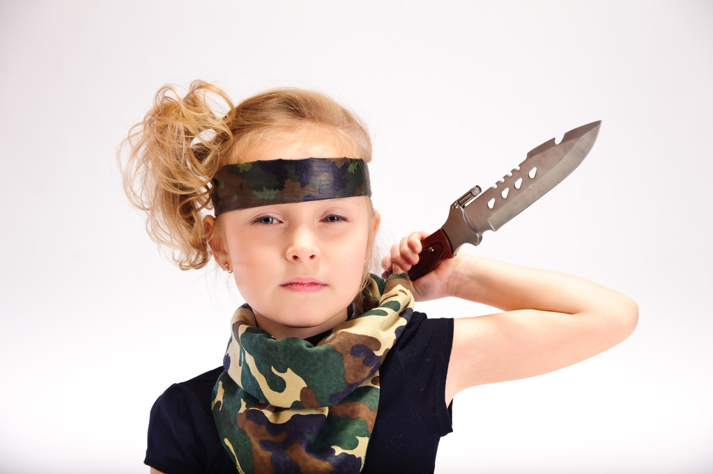 Toddler girl with an army knife - Photo, Image