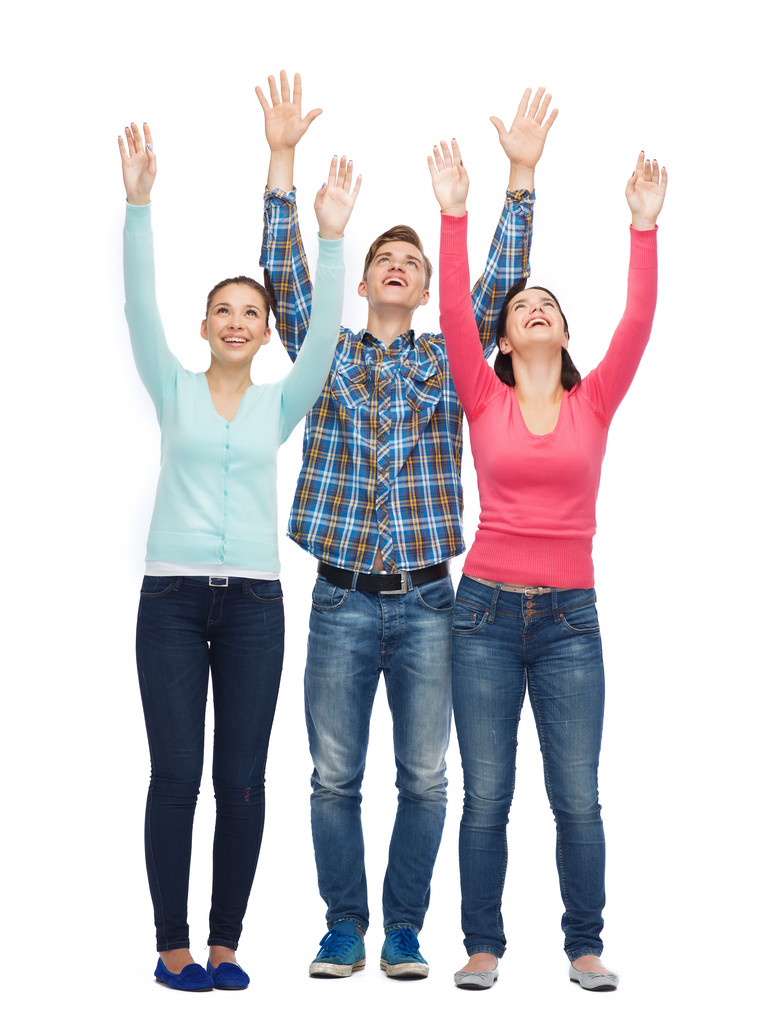 group of smiling teenagers with raised hands - Photo, Image