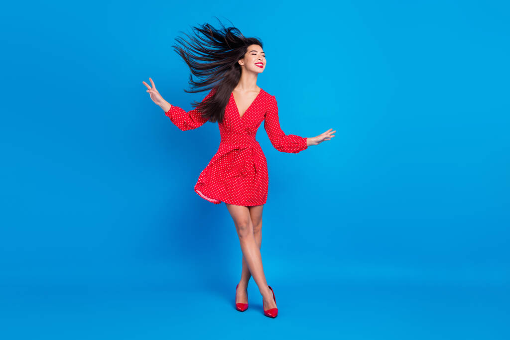 Full length body size view of attractive dreamy cheerful lady posing wind blowing isolated over bright blue color background - Photo, Image