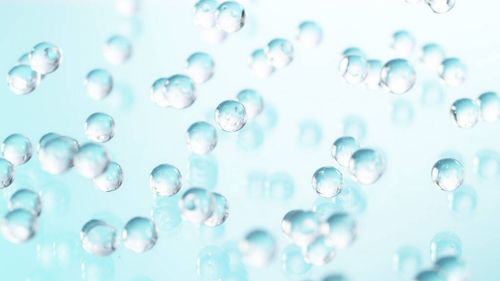 Macro de bolas de hidrogel en movimiento de congelación. Concepto de hidratación de la piel, ingredientes cosméticos, de salud y belleza. - Foto, imagen