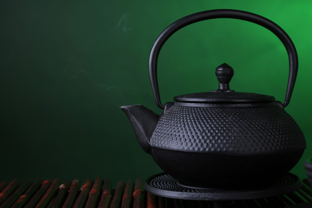 Chinese traditional teapot on bamboo mat - Photo, Image