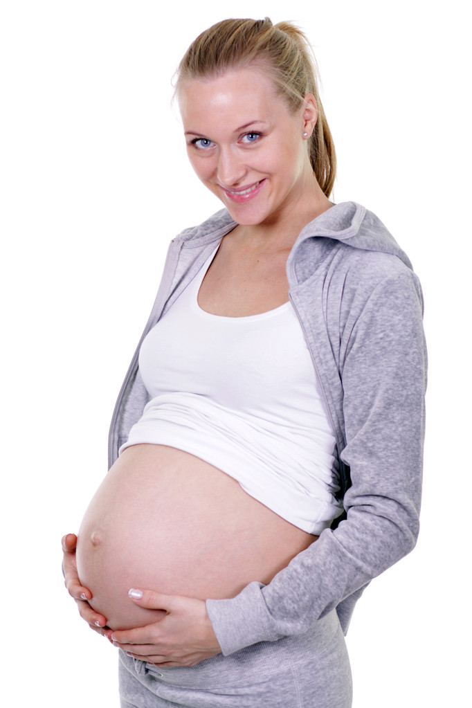 Desvestida embarazada sosteniendo sus pechos
 - Foto, imagen