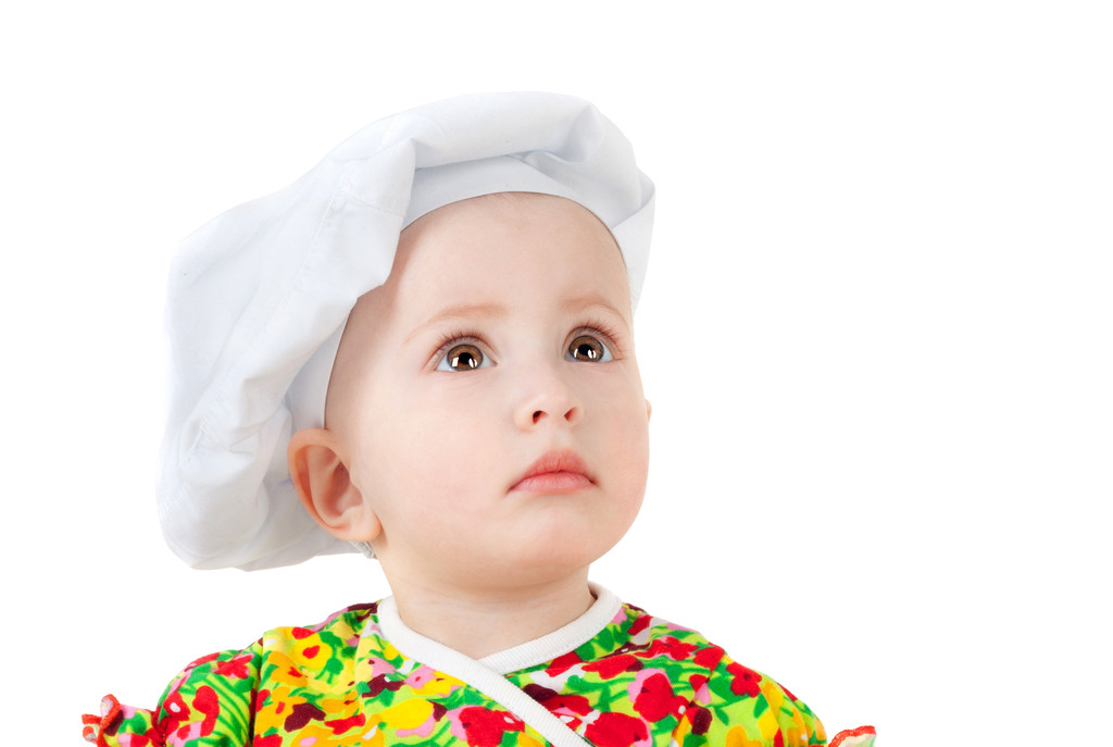 kleine baby in het GLB cook - Foto, afbeelding