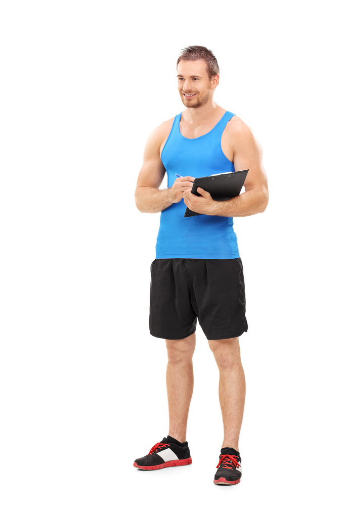 Entrenador de fitness sujetando portapapeles
 - Foto, Imagen