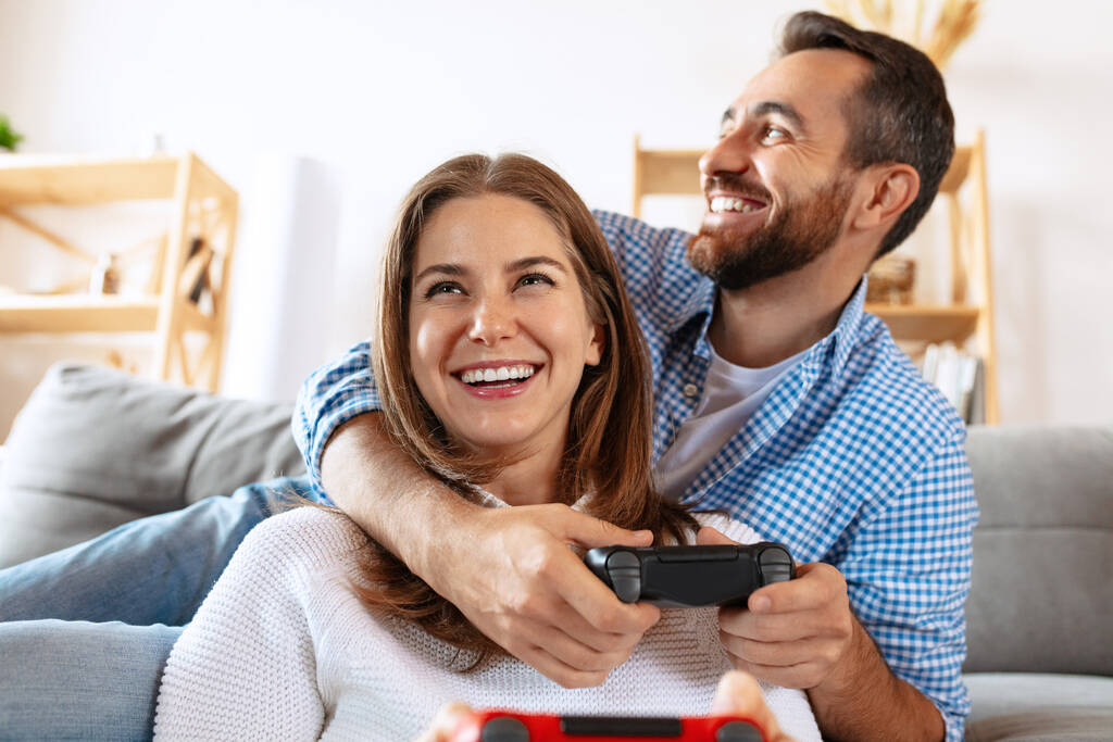 Smiling married couple spending time together at home, indoors. Middle aged couple sitting together. Concept of family, relationship - Photo, Image