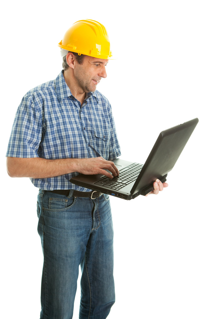 Travailleur portant un casque dur et utilisant leptop
 - Photo, image