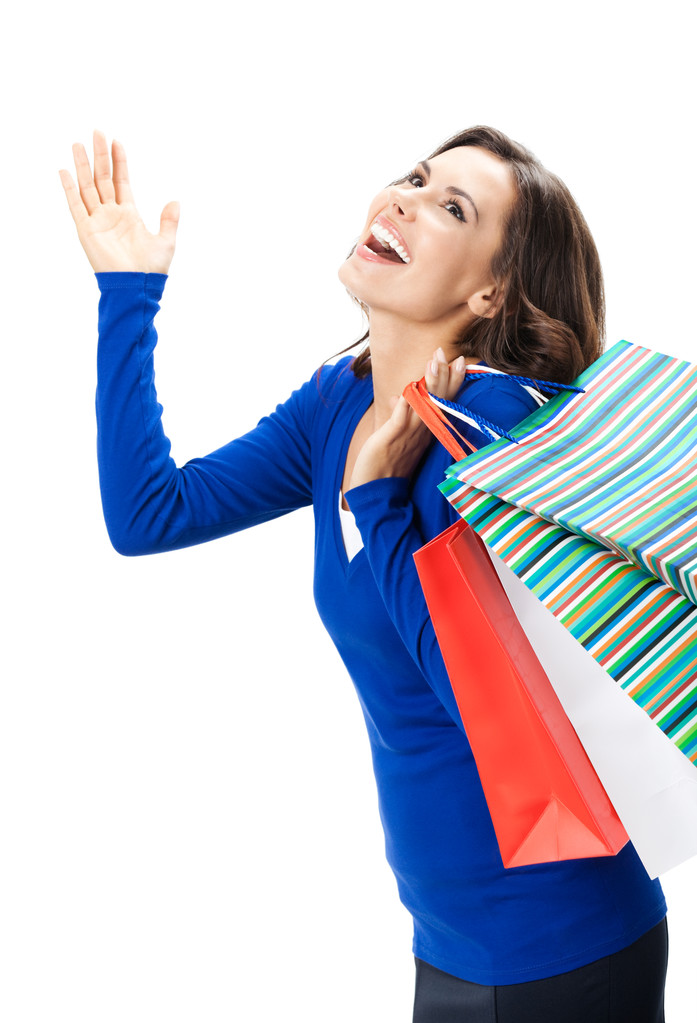 jonge gelukkig vrouw met boodschappentassen, geïsoleerd - Foto, afbeelding