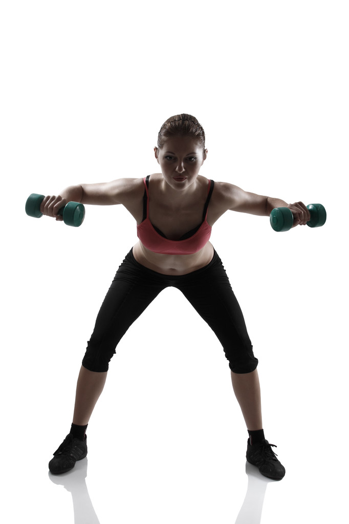 Mujer haciendo ejercicio con pesas
 - Foto, imagen
