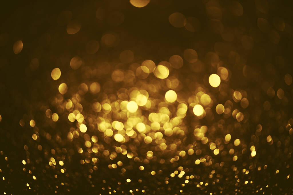 arany csillogó bokeh világítás textúra elmosódott elvont háttér születésnap, évforduló, esküvő, szilveszter vagy karácsony - Fotó, kép