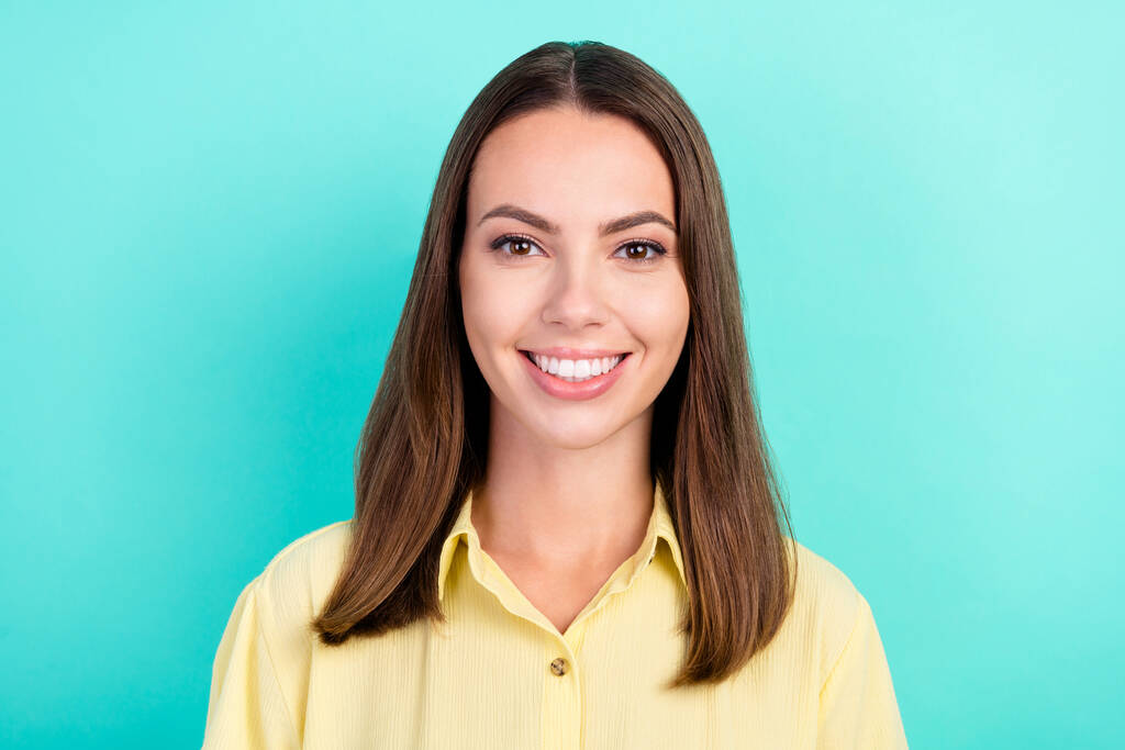 Photo of lovely millennial brunette lady wear yellow blouse isolated on teal color background - Photo, Image