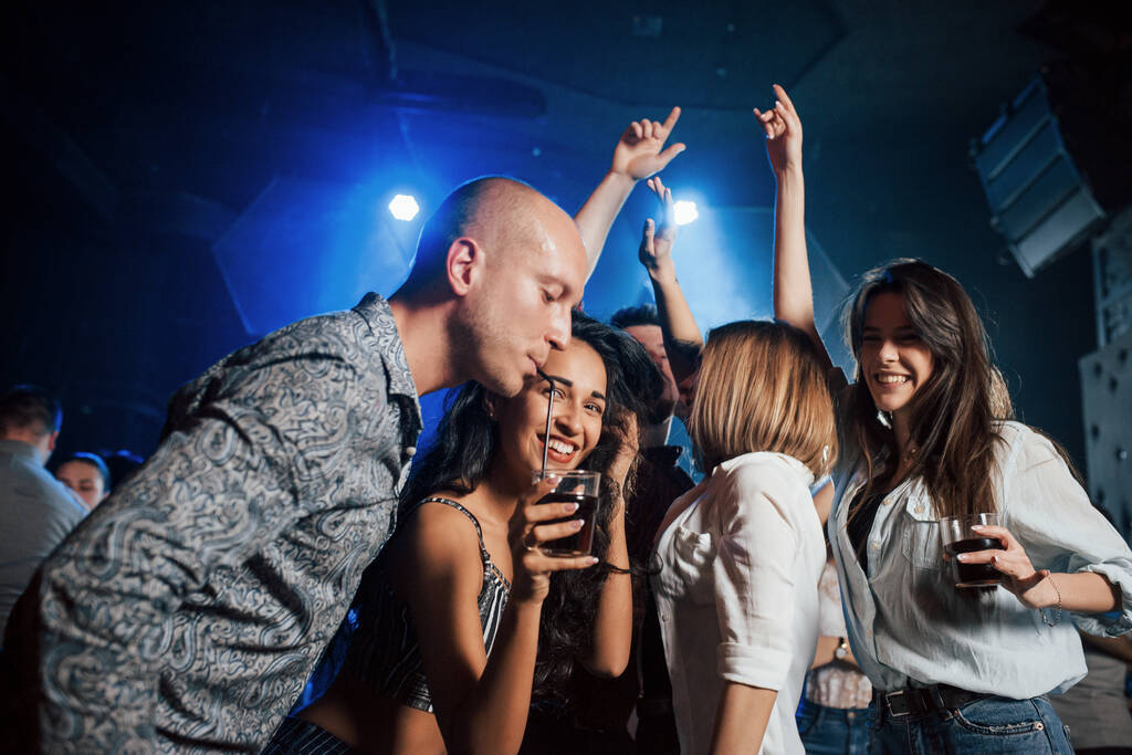 Delicious drink. Beautiful youth have party together with alcohol in the nightclub. - Photo, Image