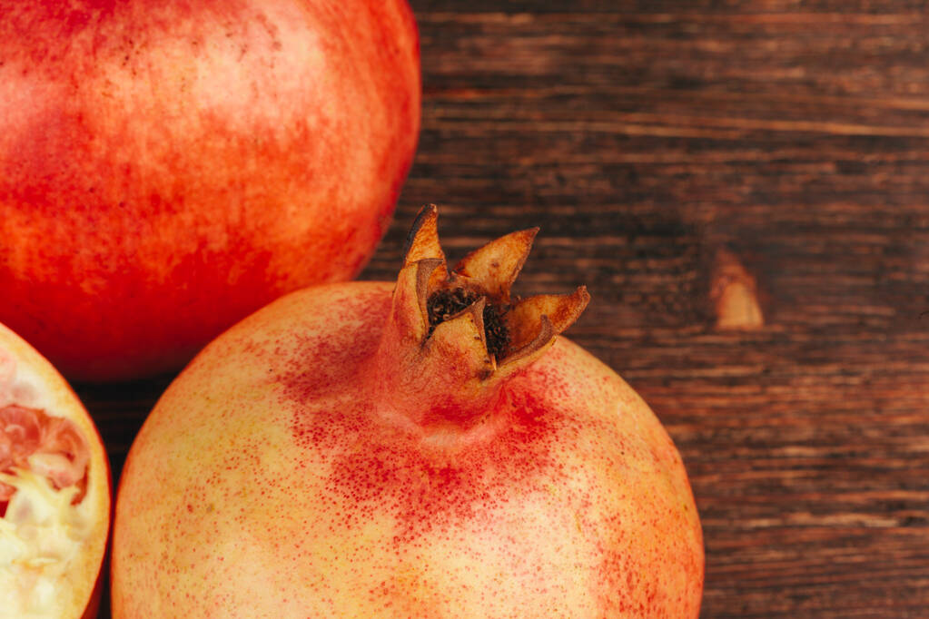 Group of pomegranate fruits close up background - Photo, Image