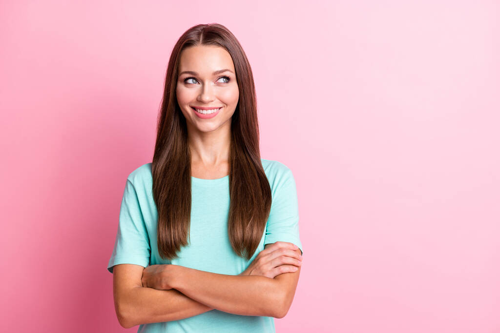 Photo of young smiling dreamy positive good mood woman with crossed arms look copyspace isolated on pink color background - Photo, Image