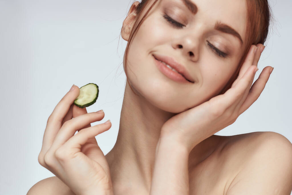attractive woman with bare shoulders cucumber skin care health - Photo, Image