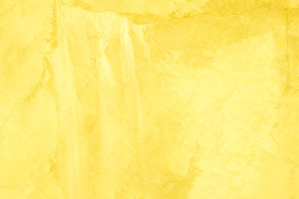 Mur en béton couleur jaune pour fond de texture. Abstrait grunge fond coloré lumineux de couleur avec effet croissant. Couleur pastel à faible contraste texturé avec rugosité et irrégularités. Peinture or ou jaune sur fond de texture de mur de ciment. - Photo, image