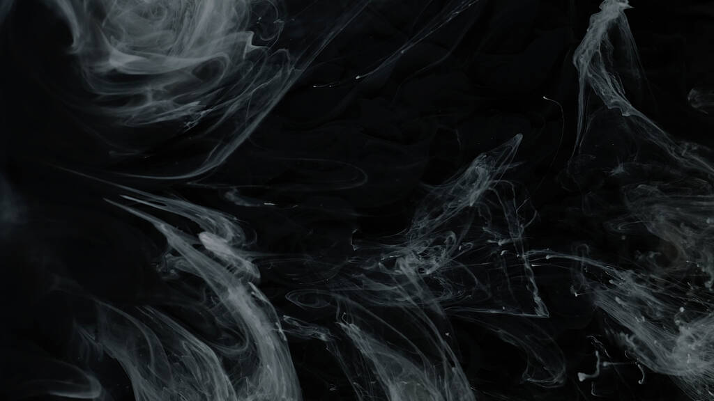 Weiße Acrylfarben in Wasser auf schwarzem Hintergrund. Schöne ehrfürchtige abstrakte Hintergrund. Weltraum-Hintergrund. - Foto, Bild
