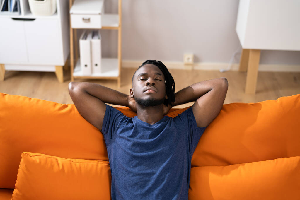 African American Man Relaxing On Sofa Or Couch - Photo, Image