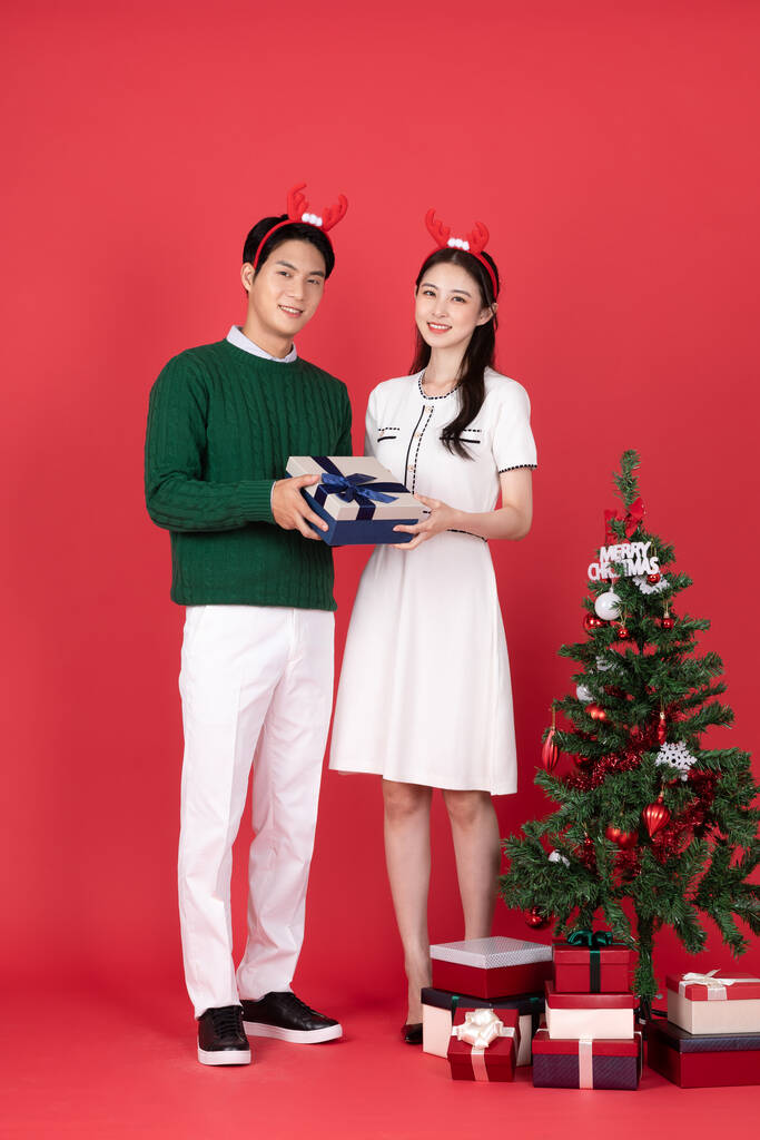 Asian Korean couple in winter fashion with rudolph hairband, Christmas shopping event concept - Photo, Image