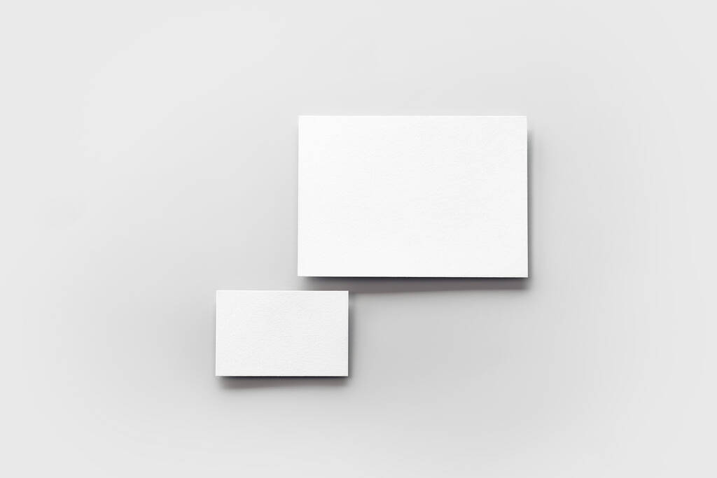 Plantilla de maqueta de tarjeta de visita moderna sobre fondo gris. Vista superior plano de dos cartas. Diseño simulado para branding, publicidad y diseño - Foto, imagen
