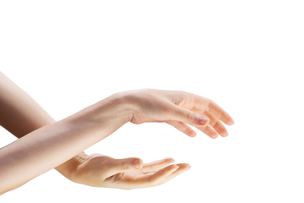 Két gyönyörű női kéz fehér alapon kapcsolódik egymáshoz.. - Fotó, kép
