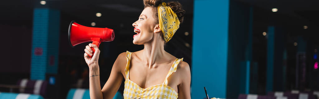 side view of pin up woman screaming in megaphone, banner - Photo, Image