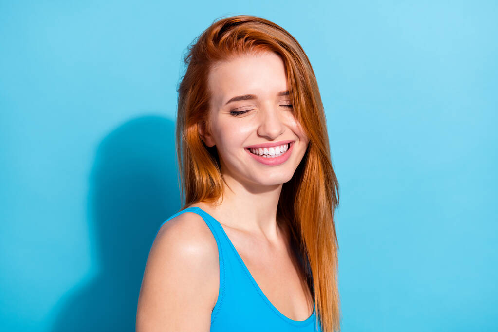 Portrait of attractive dreamy cheerful girl posing enjoying isolated over bright blue color background - Photo, Image