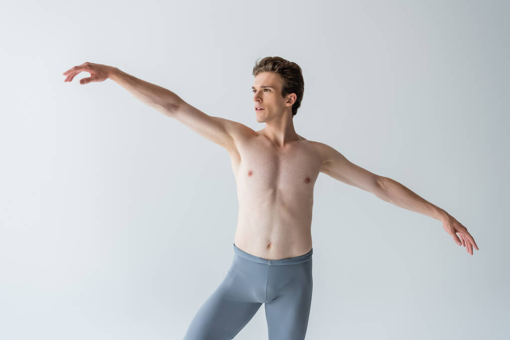 shirtless ballet dancer performing isolated on grey  - Photo, Image