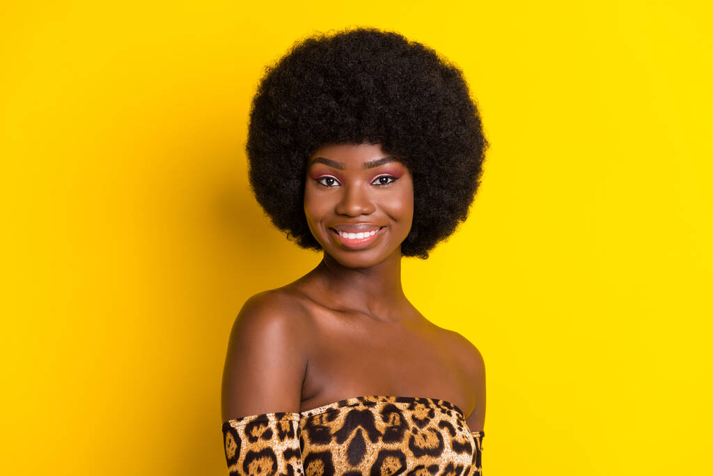 Photo of shiny adorable dark skin lady wear off-shoulders clothes smiling isolated yellow color background - Photo, Image