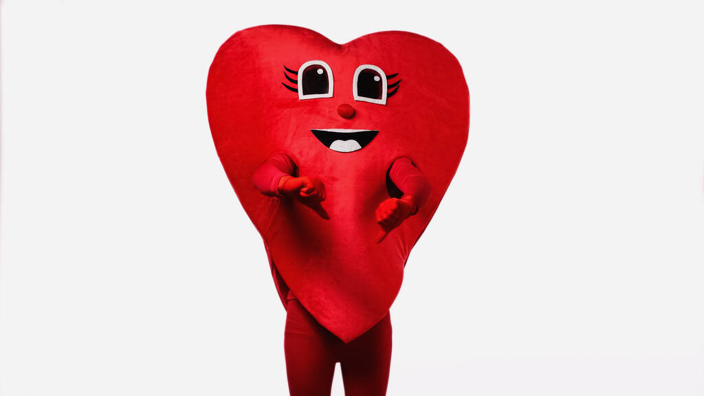 людина в червоному костюмі серця, що показує великі пальці вниз ізольовано на білому
 - Фото, зображення