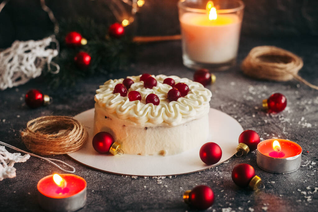 Christmas cake. Delicious cake with winter decor. Lingonberry cake on the table  - Photo, Image