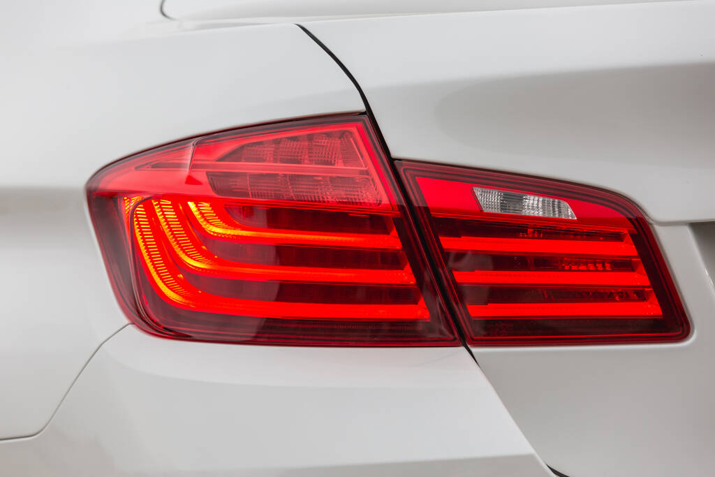 The rear left headlight of a modern car is white. - Foto, Imagen