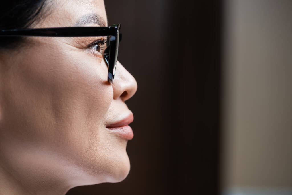 profile of asian woman in eyeglasses, eye care concept - 写真・画像