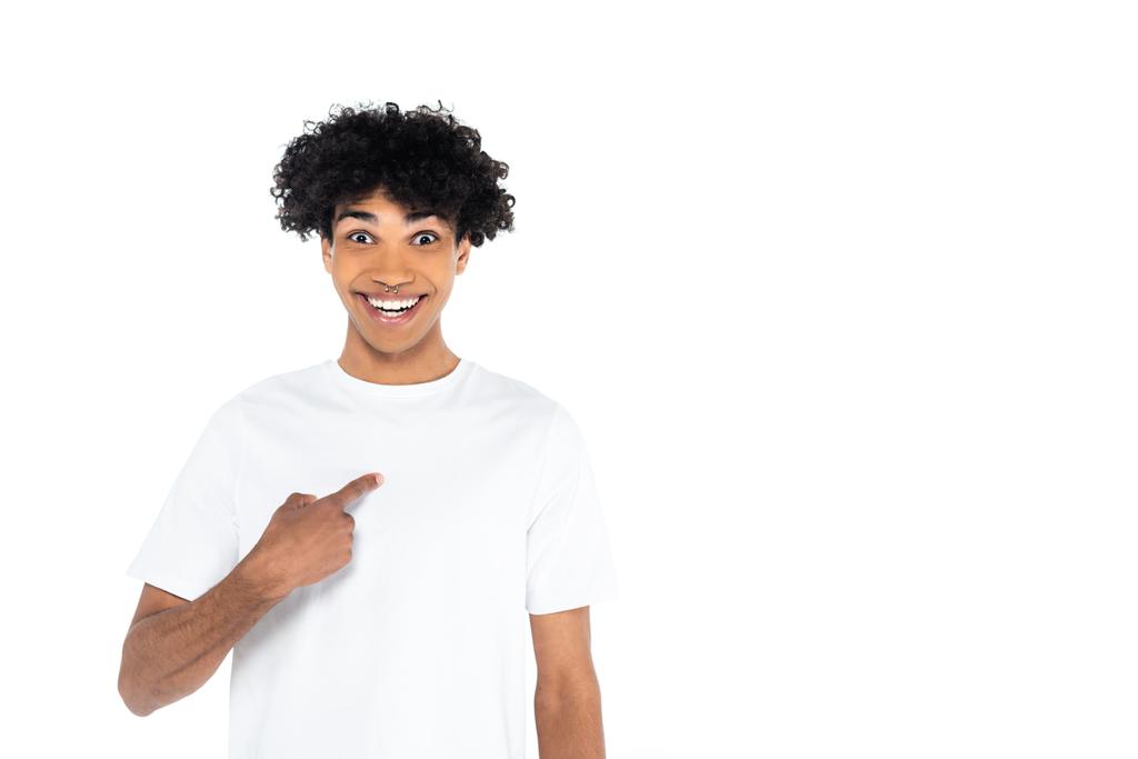surprised and happy african american man looking at camera and pointing with finger at himself isolated on white - Foto, Imagem